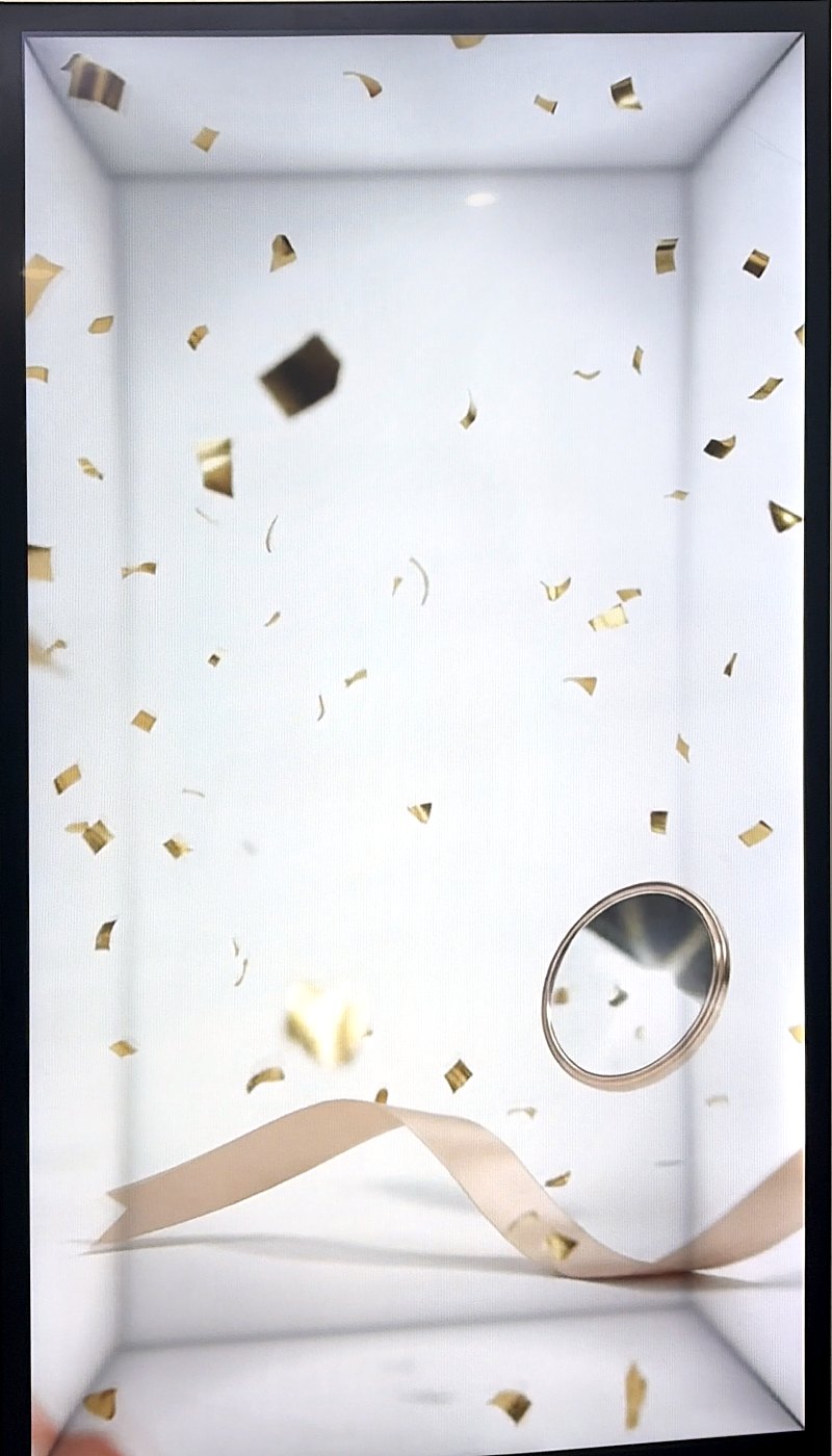 Gold confetti and ribbon on a Translook display